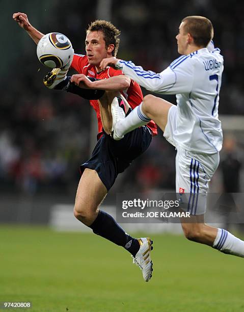 Morten Moldskred of Norway and Slovakia's Vladimir Weiss jr. Fight for a ball during their friendly match between Slovakia and Norway in Zilina on...