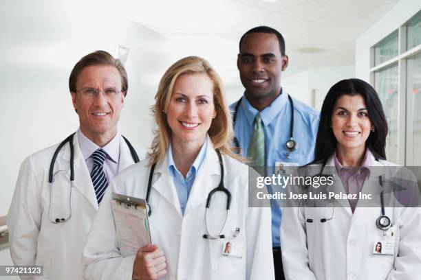 doctors standing together in hospital - west new york new jersey stock-fotos und bilder