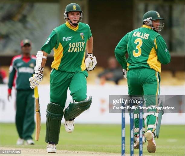 Graeme Smith and Jacques Kallis of South Africa add another run to their match-winning partnership in the ICC Champions Trophy match between...