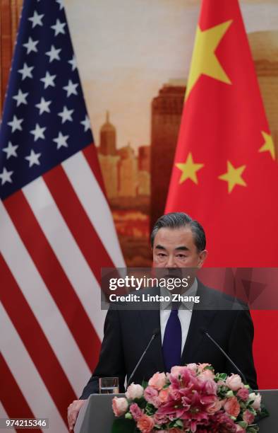 Chinese Foreign Minister Wang Yi speaks during a press conference with U.S. Secretary of State Mike Pompeo at the Great Hall of the People on June...