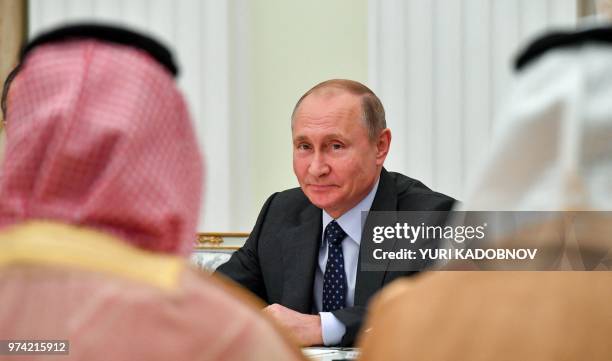 Russian President Vladimir Putin attends a meeting with Saudi Crown Prince Mohammed bin Salman at the Kremlin in Moscow on June 14, 2018.