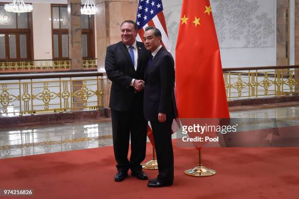 United States Secretary of State, Mike Pompeo is greeted by Chinese Foreign Minister, Wang Yi prior to their meeting in the Great Hall of the People...