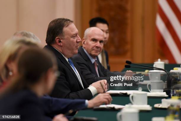 United States Secretary of State, Mike Pompeo speaks with Chinese Foreign Minister, Wang Yi prior to their meeting in the Great Hall of the People on...