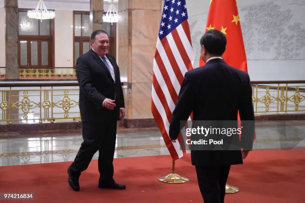 United States Secretary of State, Mike Pompeo is greeted by Chinese Foreign Minister, Wang Yi prior to their meeting in the Great Hall of the People...