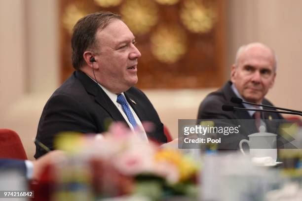 United States Secretary of State, Mike Pompeo speaks with Chinese Foreign Minister, Wang Yi prior to their meeting in the Great Hall of the People on...