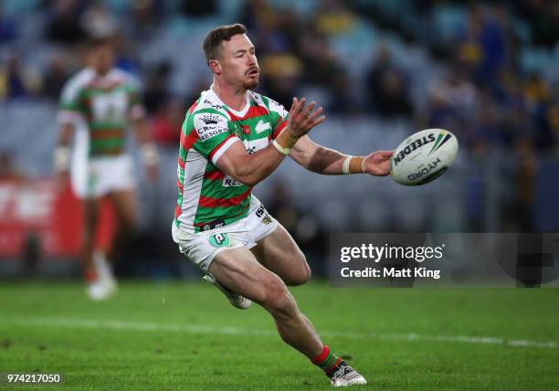 Damien Cook of the Rabbitohs passes during the round 15 NRL match between the Parramatta Eels and the South Sydney Rabbitohs at ANZ Stadium on June...