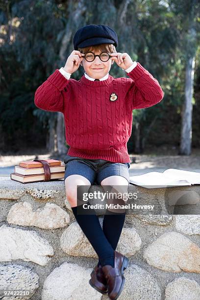 young prep school student sitting with books - over the knee stock pictures, royalty-free photos & images