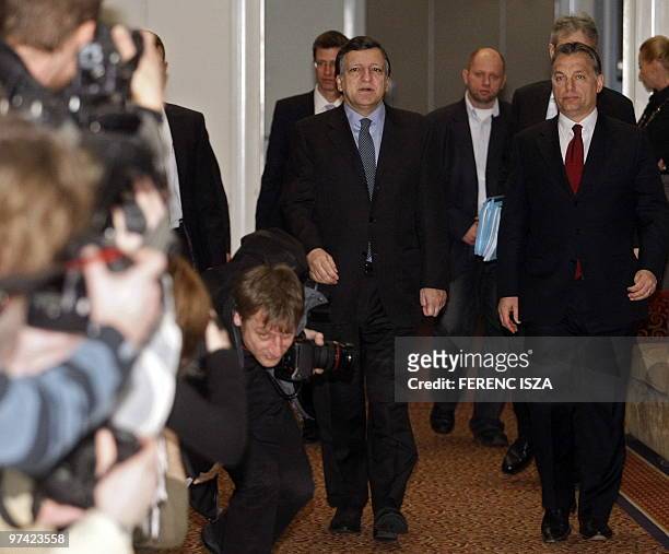 European Commission Chairman Jose Manuel Barroso and the leader of the Hungarian Civic Union party, Viktor Orban, arrive on March 4, 2010 to attend a...