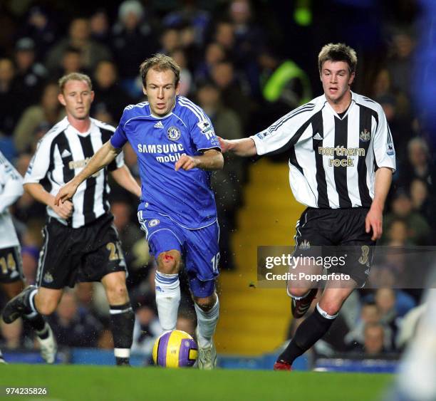 Paul Huntington of Newcastle United and Arjen Robben of Chelsea in action during the Premiership match between Chelsea and Newcastle United at...