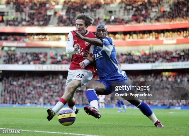 Alexander Hleb of Arsenal clashes with Noe Pamarot of Portsmouth during the Barclays Premiership match between Arsenal and Portsmouth at the Emirates...