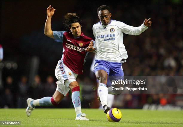 Juan Pablo Angel of Aston Villa and Michael Essien of Chelsea in action during the Barclays Premiership match between Aston Villa and Chelsea at...