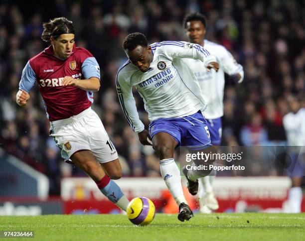 Milan Barros of Aston Villa and Michael Essien of Chelsea in action during the Barclays Premiership match between Aston Villa and Chelsea at Villa...