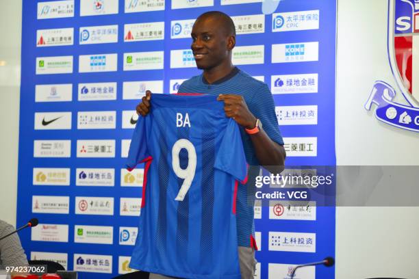 Shanghai Shenhua new signing Demba Ba attends a press conference on June 14, 2018 in Shanghai, China.