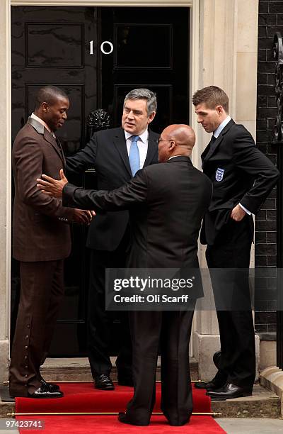 British Prime Minister Gordon Brown and South African President Jacob Zuma pose for photographs with England footballer Steven Gerrard and Aaron...