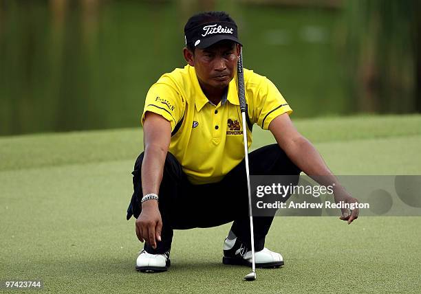 Thaworn Wiratchant of Thailand lines up a putt on the 15th hole during the first round of the Maybank Malaysian Open at the Kuala Lumpur Golf and...