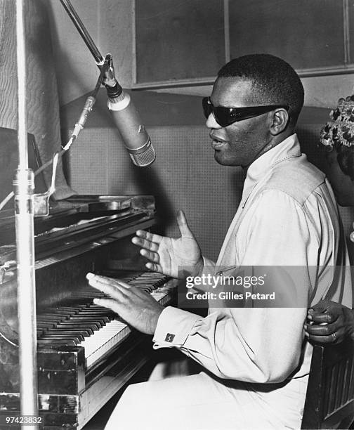 Ray Charles at the piano in the recording studio in 1962 in the United States.