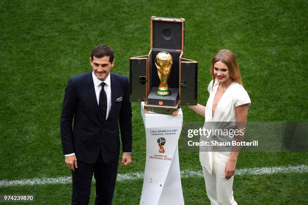 Spain legend Iker Casillas and model Natalia Vodianova show the World Cup trophy prior to the 2018 FIFA World Cup Russia Group A match between Russia...