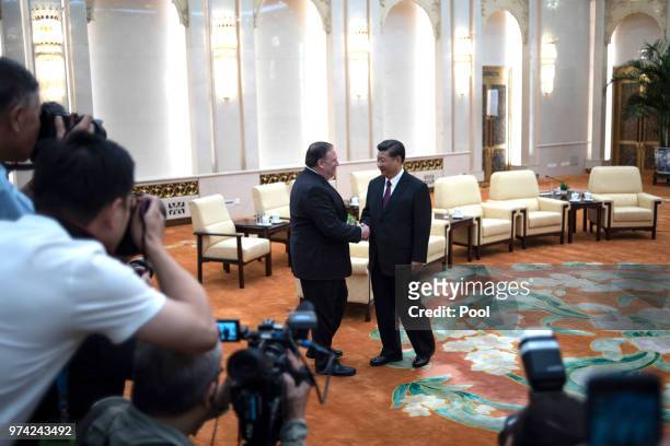 Secretary of State Mike Pompeo shakes hands with Chinese President Xi Jinping during a meeting at the Great Hall of the People June 14, 2018 in...