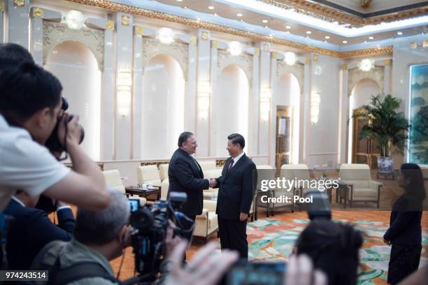 Secretary of State Mike Pompeo shakes hands with Chinese President Xi Jinping during a meeting at the Great Hall of the People June 14, 2018 in...