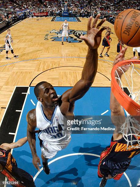 Brandon Bass of the Orlando Magic shoots against the Golden State Warriors during the game on March 3, 2010 at Amway Arena in Orlando, Florida. NOTE...