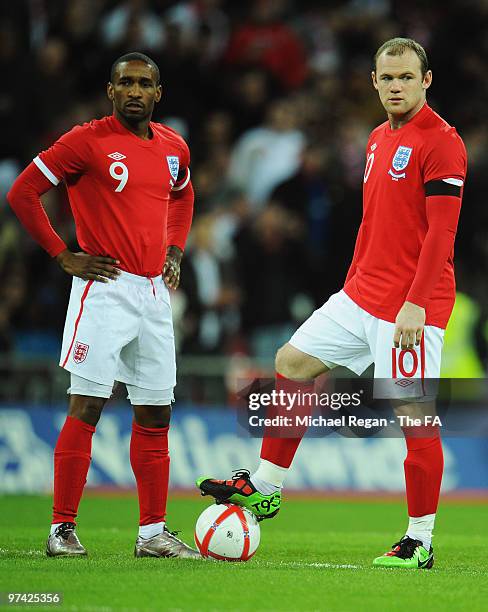 Jermain Defoe and Wayne Rooney of England wait to kick off prior to the International Friendly match between England and Egypt at Wembley Stadium on...