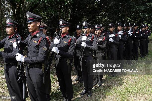 Thai police officers assemble ahead of the funeral ceremony of a Muslim colleague who was killed by suspected separatist militants on February 22 in...