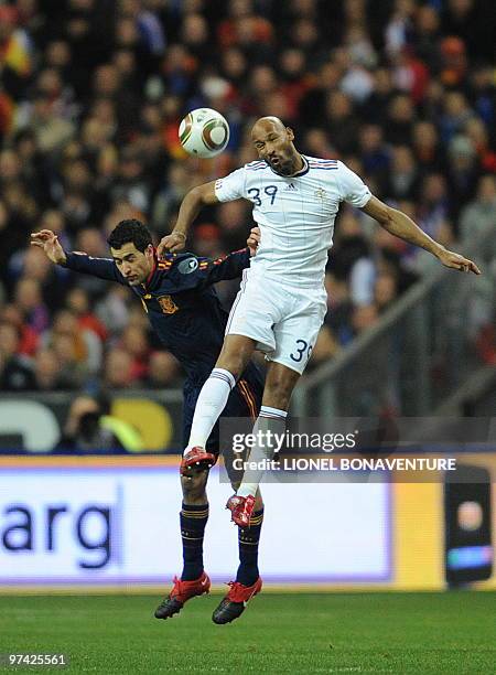 France's attacker Nicolas Anelka jumps for a header with Spain's defender Alvaro Arbeloa during a friendly international football match at the stade...