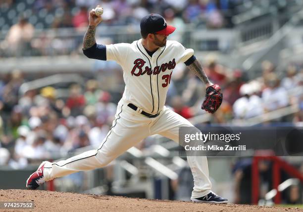 Pitcher Peter Moylan of the Atlanta Braves throws a pitch during the game against the Miami Marlins at SunTrust Park on May 20, 2018 in Atlanta,...