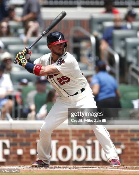 Catcher Tyler Flowers of the Atlanta Braves swings during the game against the Miami Marlins at SunTrust Park on May 20, 2018 in Atlanta, Georgia.