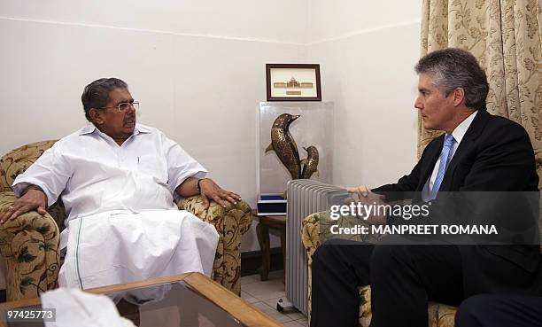 Indian Overseas Indian Affairs Minister Vayalar Ravi speaks with Australian Foreign Minister Stephen Smith during their meeting in New Delhi on March...