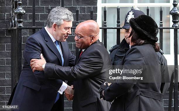 Gordon Brown, U.K. Prime minister, left, greets Jacob Zuma, South Africa's president, center, and his wife wife Thobeka, on the steps of 10 Downing...