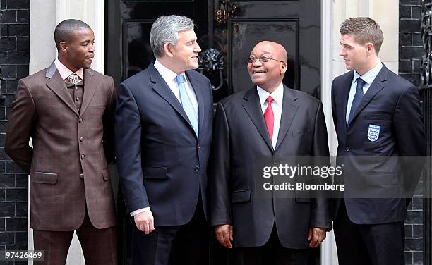 Gordon Brown, U.K. Prime minister, second left, stands with Jacob Zuma, South Africa's president, third left, and soccer players, England's Steven...