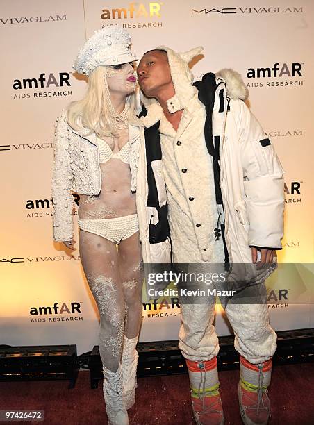 Viva Glam spokesperson Lady Gaga and Terence Koh walk the red carpet at amfAR Gala at Cipriani 42nd Street on February 10, 2010 in New York City.