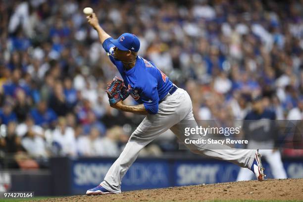 Pedro Strop of the Chicago Cubs throws a pitch during the eighth inning of a game against the Milwaukee Brewers at Miller Park on June 11, 2018 in...