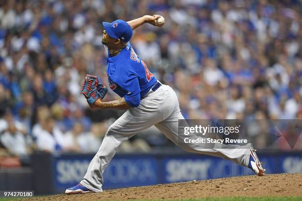 Pedro Strop of the Chicago Cubs throws a pitch during a game against the Milwaukee Brewers at Miller Park on June 11, 2018 in Milwaukee, Wisconsin....