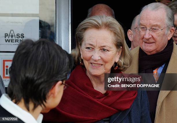 Antwerp Province Governor Cathy Berx, Queen Paola and King Albert II greet people as they arrive for their visit to the offices of Passwerk, in...