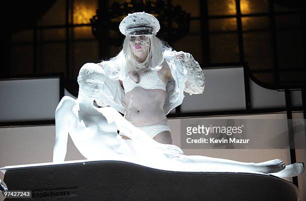 Lady Gaga performs at AMFAR on a Terence Koh designed piano, inspired by the MáAáC Viva Glam campaign at Cipriani 42nd Street on February 10, 2010 in...