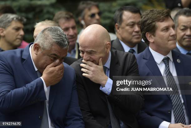 S President Gianni Infantino and AFA's President Claudio Tapia chat next to CONMEBOL's President Alejandro Dominguez during the inauguration of the...