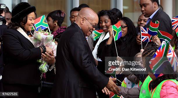 South African President Jacob Zuma and wife Thobeka Madiba Zuma meet children from local schools while visiting a Sainsburys Supermarket in Greenwich...
