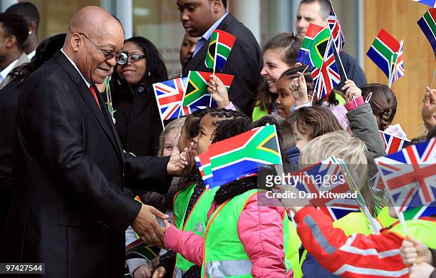 South African President Jacob Zuma and wife Thobeka Madiba Zuma meet children from local schools while visiting a Sainsburys Supermarket in Greenwich...