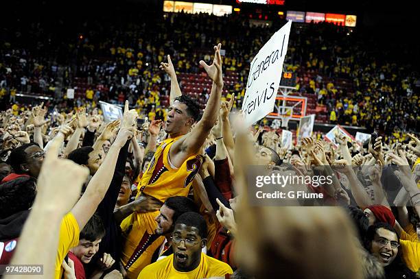 Greivis Vasquez of the Maryland Terrapins celebrates with fans after a 79-72 victory against the Duke Blue Devils at the Comcast Center on March 3,...