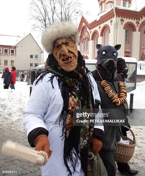 People celebrate �Uzgavenes� dressed as gypsies, horses, goats in the old town of Vilnius, on February 16, 2010. �Uzgavenes� is held before the...