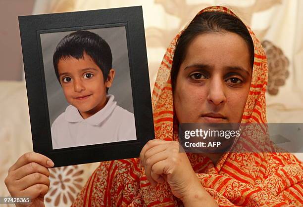 Akila Naqqash holds a picture of her five-year-old son Sahil Saeed, in Oldham, Manchester, north-west England, on March 4, 2010. The mother of a...