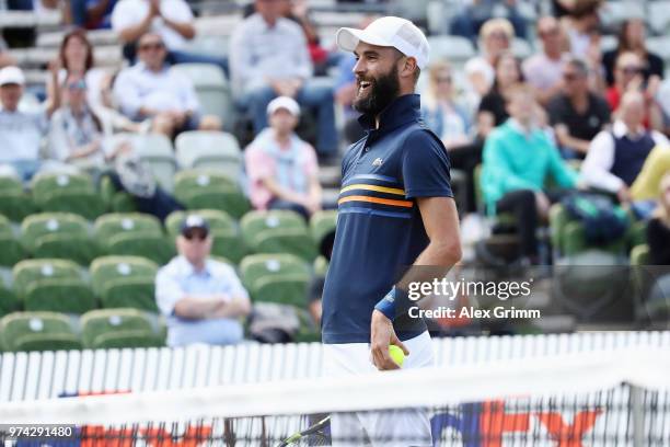 Benoit Paire of France reacts after playing a behind the back half-volley during his match against Tomas Berdych of Czech Republic during day 4 of...