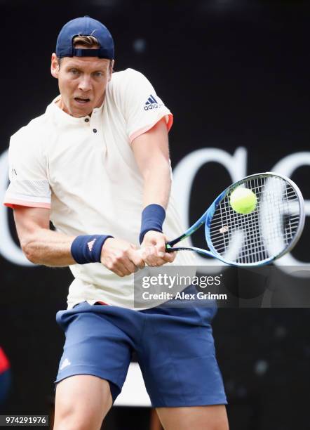 Tomas Berdych of Czech Republic plays a backhand to Benoit Paire of France during day 4 of the Mercedes Cup at Tennisclub Weissenhof on June 14, 2018...