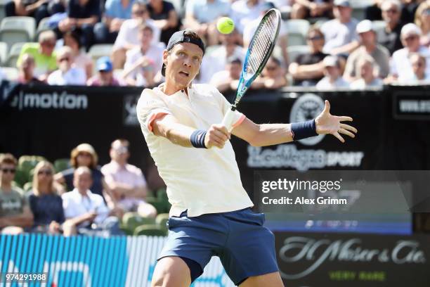 Tomas Berdych of Czech Republic plays a backhand to Benoit Paire of France during day 4 of the Mercedes Cup at Tennisclub Weissenhof on June 14, 2018...