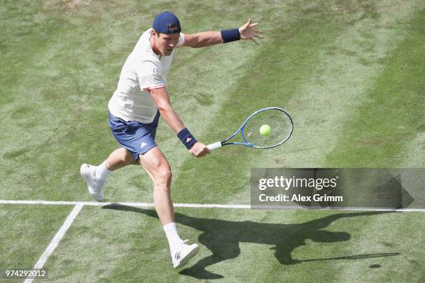 Tomas Berdych of Czech Republic plays a backhand to Benoit Paire of France during day 4 of the Mercedes Cup at Tennisclub Weissenhof on June 14, 2018...