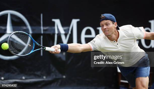 Tomas Berdych of Czech Republic plays a forehand to Benoit Paire of France during day 4 of the Mercedes Cup at Tennisclub Weissenhof on June 14, 2018...