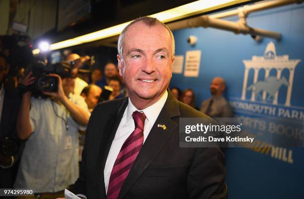 Governor of New Jersey Phil Murphy places the first bet at the William Hill Sports Book at Monmouth Park as it opens and welcomes public to place...