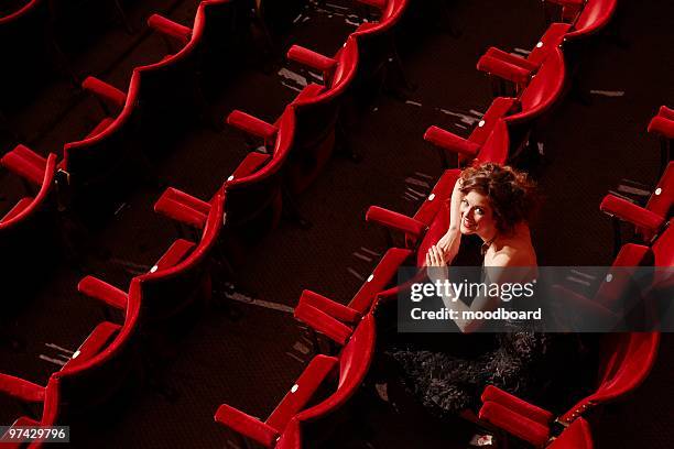 woman sitting in theatre stalls, high angle view - actor audition stock pictures, royalty-free photos & images